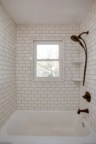 a view of a house with a yard and garage