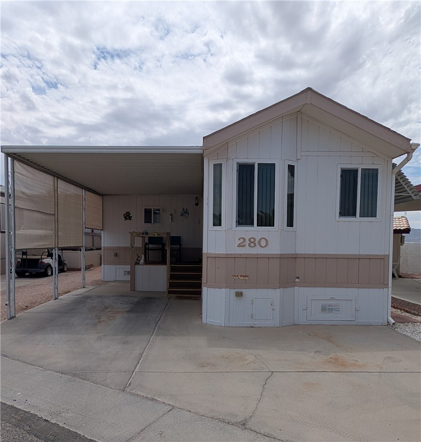 2000 Ramar Road, Unit 280 Bullhead City, AZ 86442 - Photo 1 of 63 a front view of a house with outdoor space