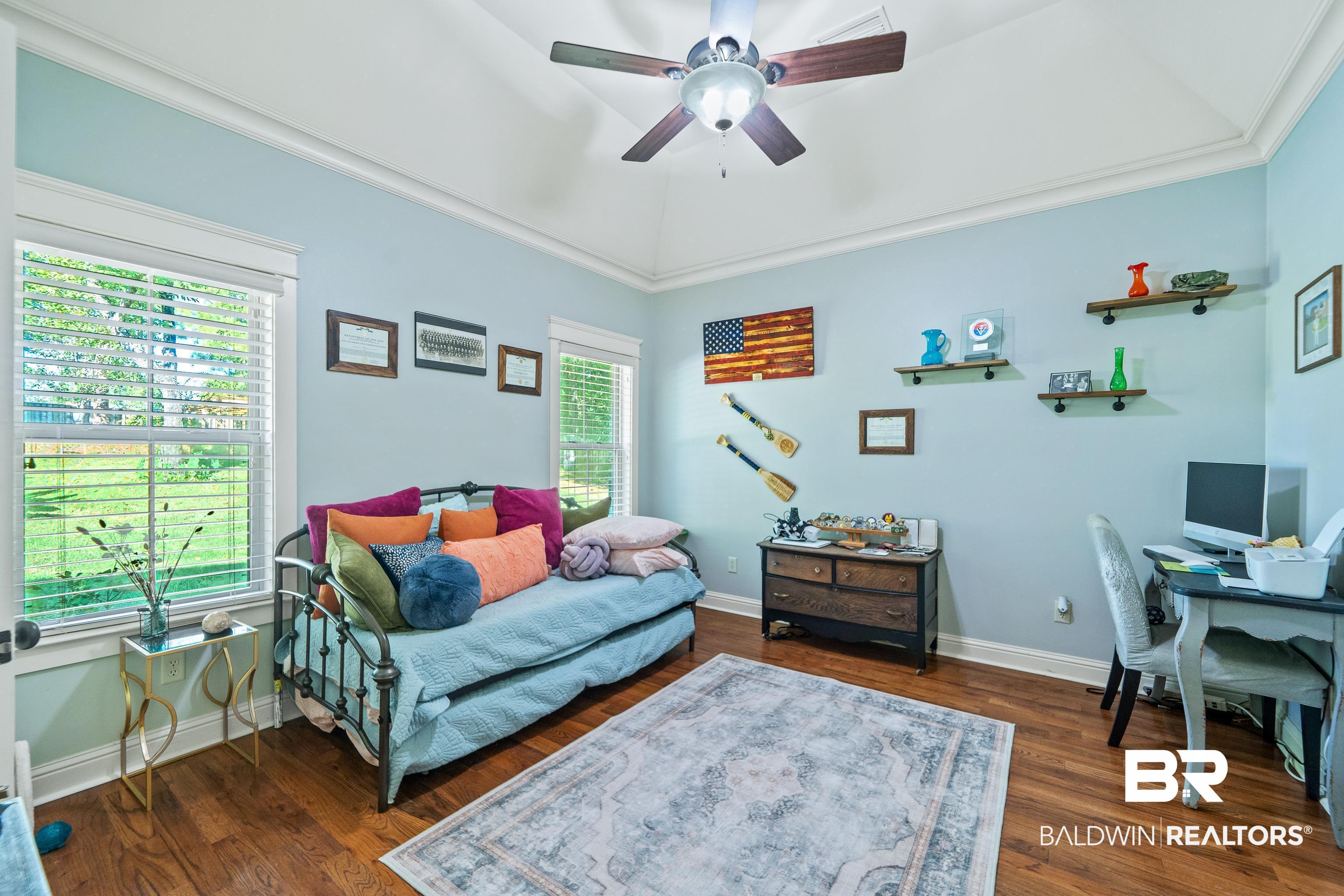 31829 Butler Drive Daphne, AL 36527 - Photo 30 of 48 Bedroom featuring crown molding, vaulted ceiling, dark hardwood / wood-style flooring, and ceiling fan