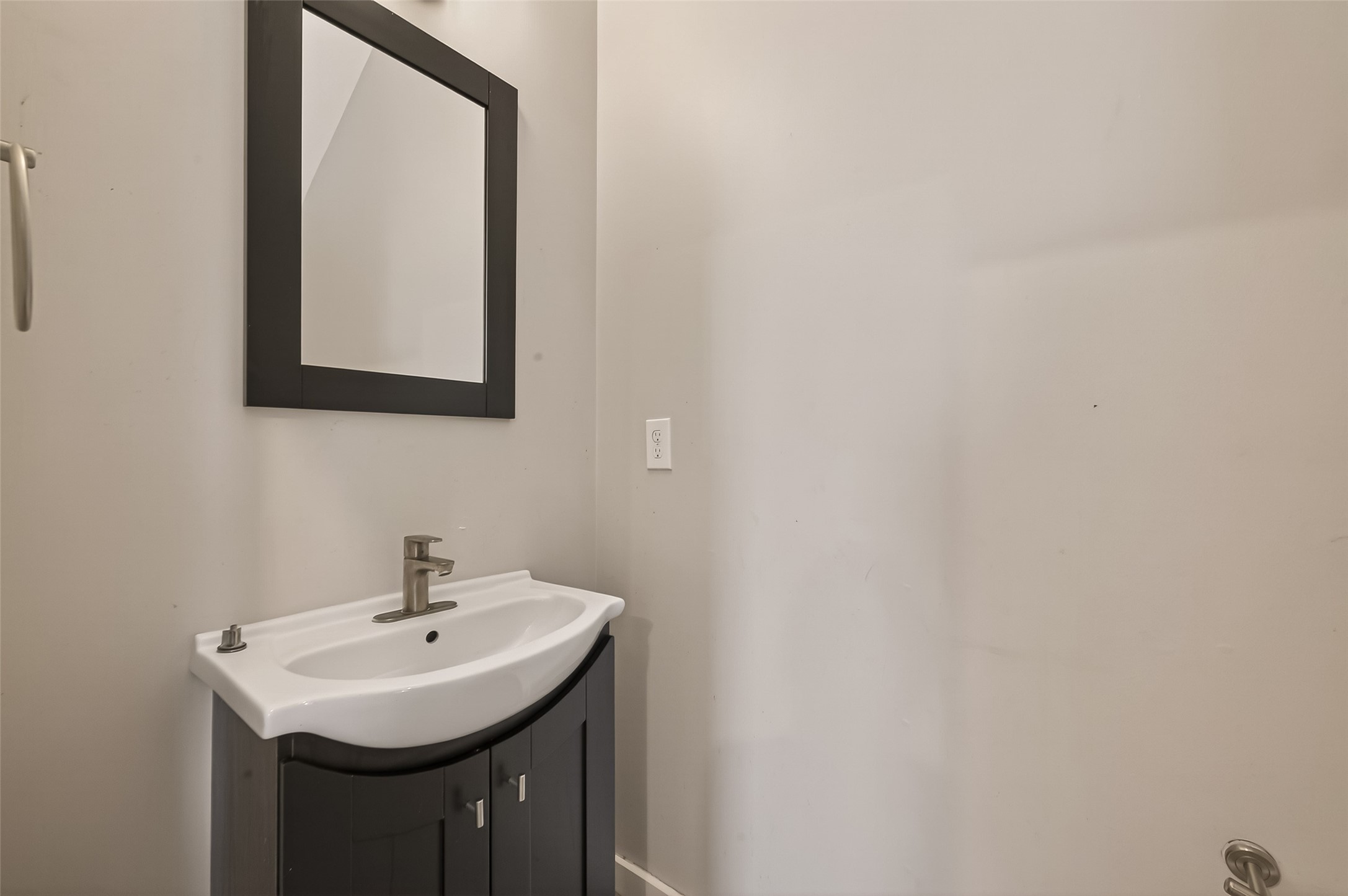 1819 South Street Houston, TX 77009 - Photo 13 of 27 a bathroom with a sink and a mirror
