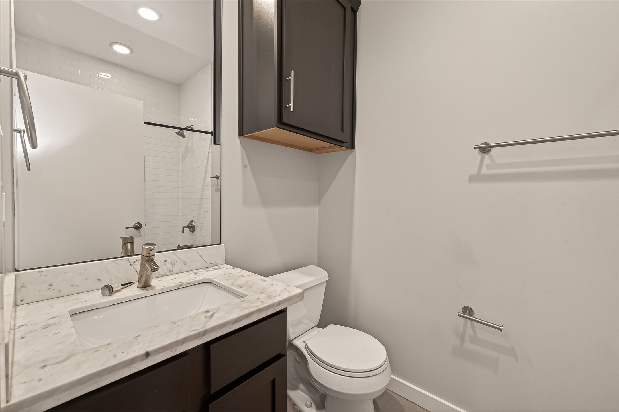 1819 South Street Houston, TX 77009 - Photo 16 of 27 a bathroom with a granite countertop sink toilet and shower