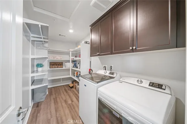 a bathroom with a double vanity sink toilet and a mirror