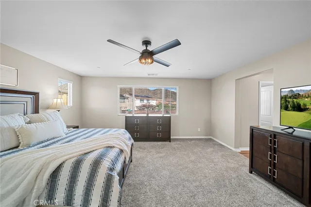 a spacious bathroom with a double vanity sink a mirror and a shower
