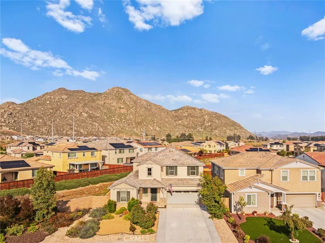 an aerial view of a house with a swimming pool