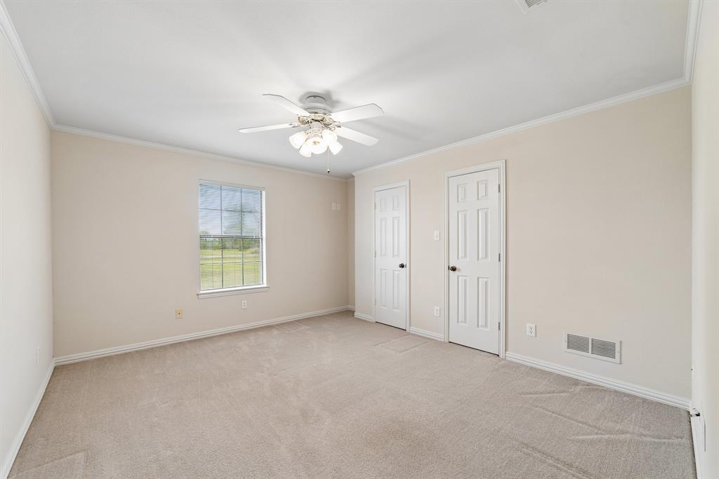 1175 Bloom Street Lucas, TX 75002 - Photo 22 of 36 an empty room with windows and fan
