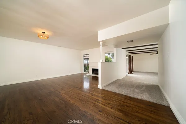 a large kitchen with stainless steel appliances granite countertop a sink and cabinets