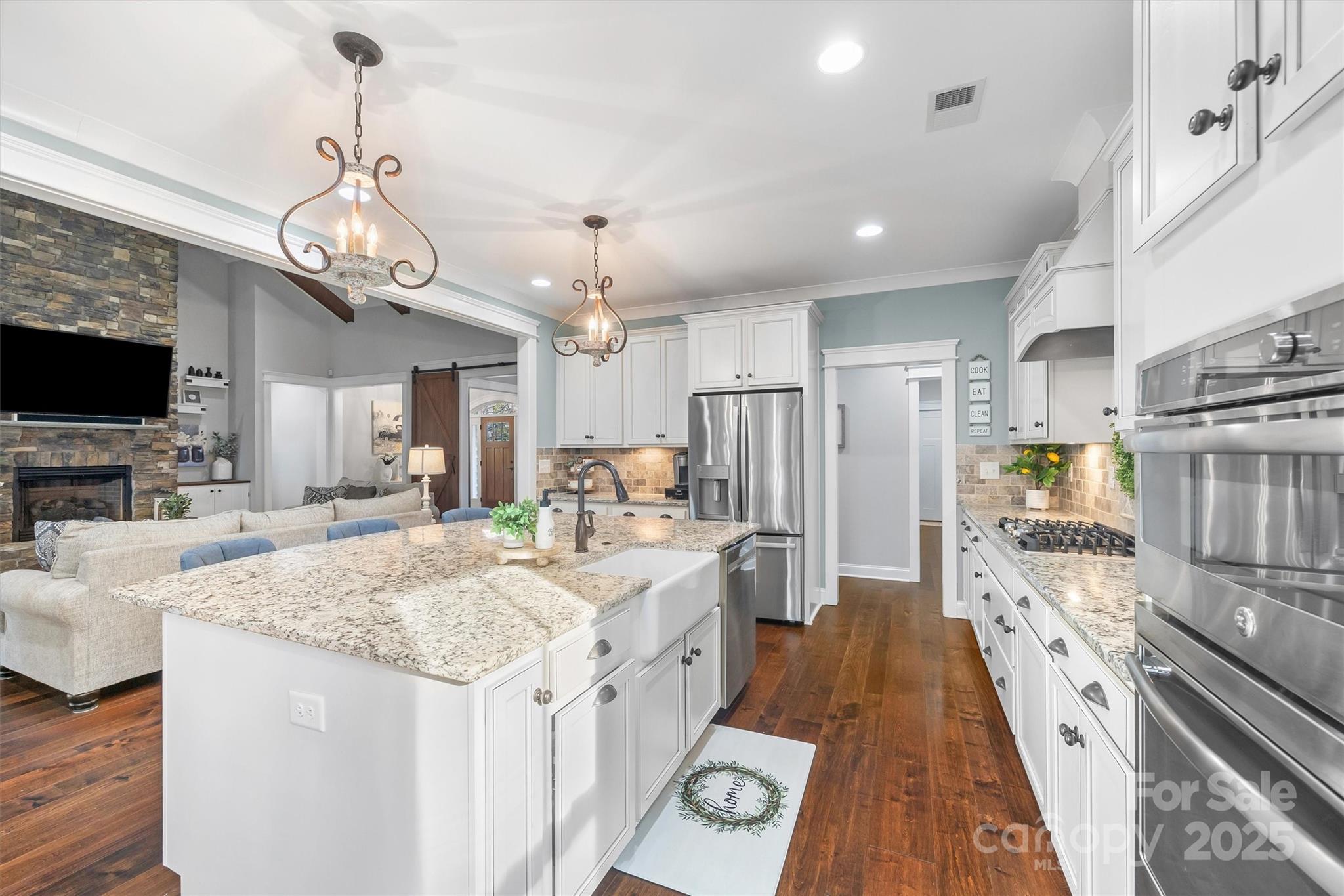 4221 Persimmon Road Lancaster, SC 29720 - Photo 11 of 48 a large kitchen with kitchen island a large island in it