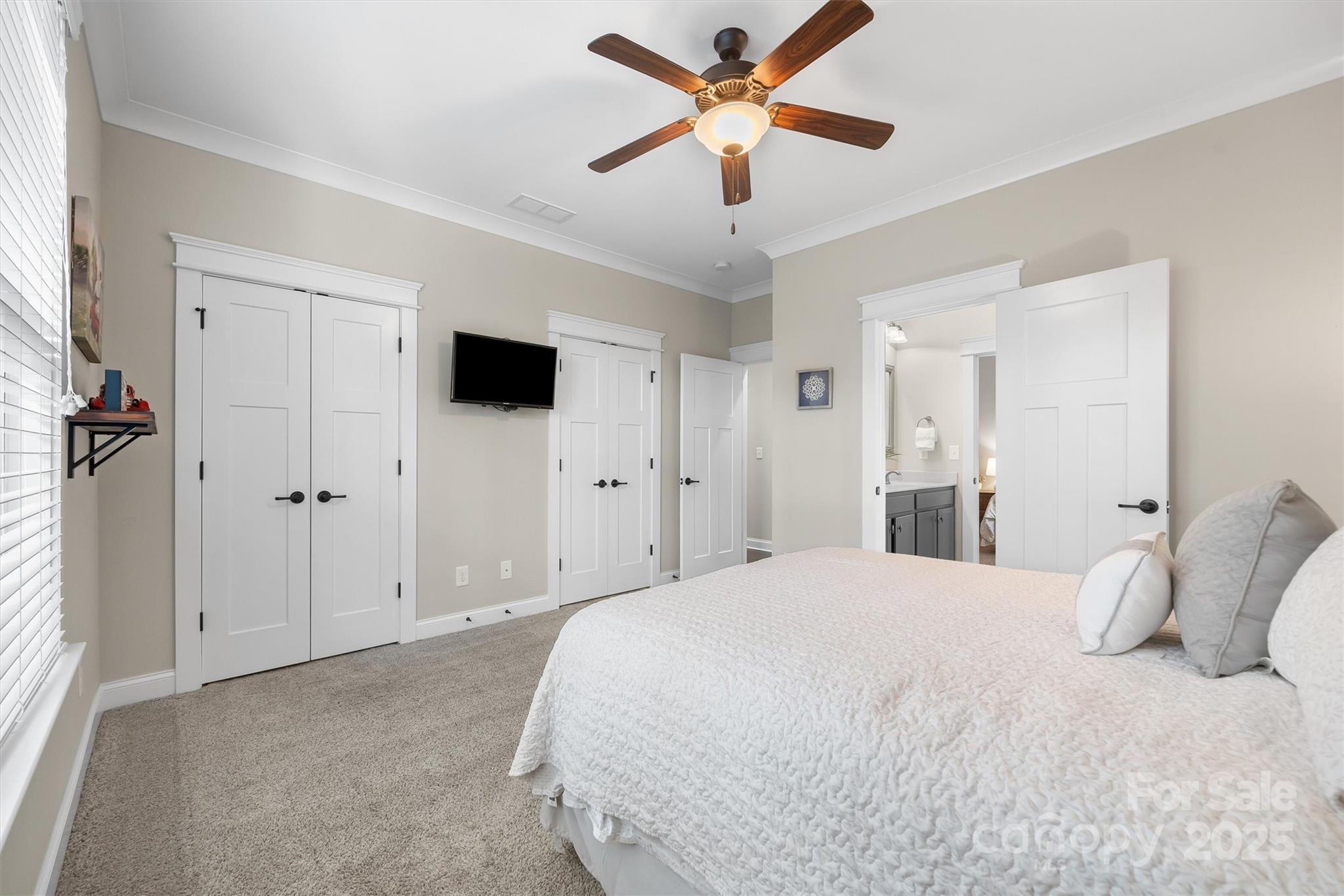 4221 Persimmon Road Lancaster, SC 29720 - Photo 15 of 48 a bedroom with a large bed and a ceiling fan