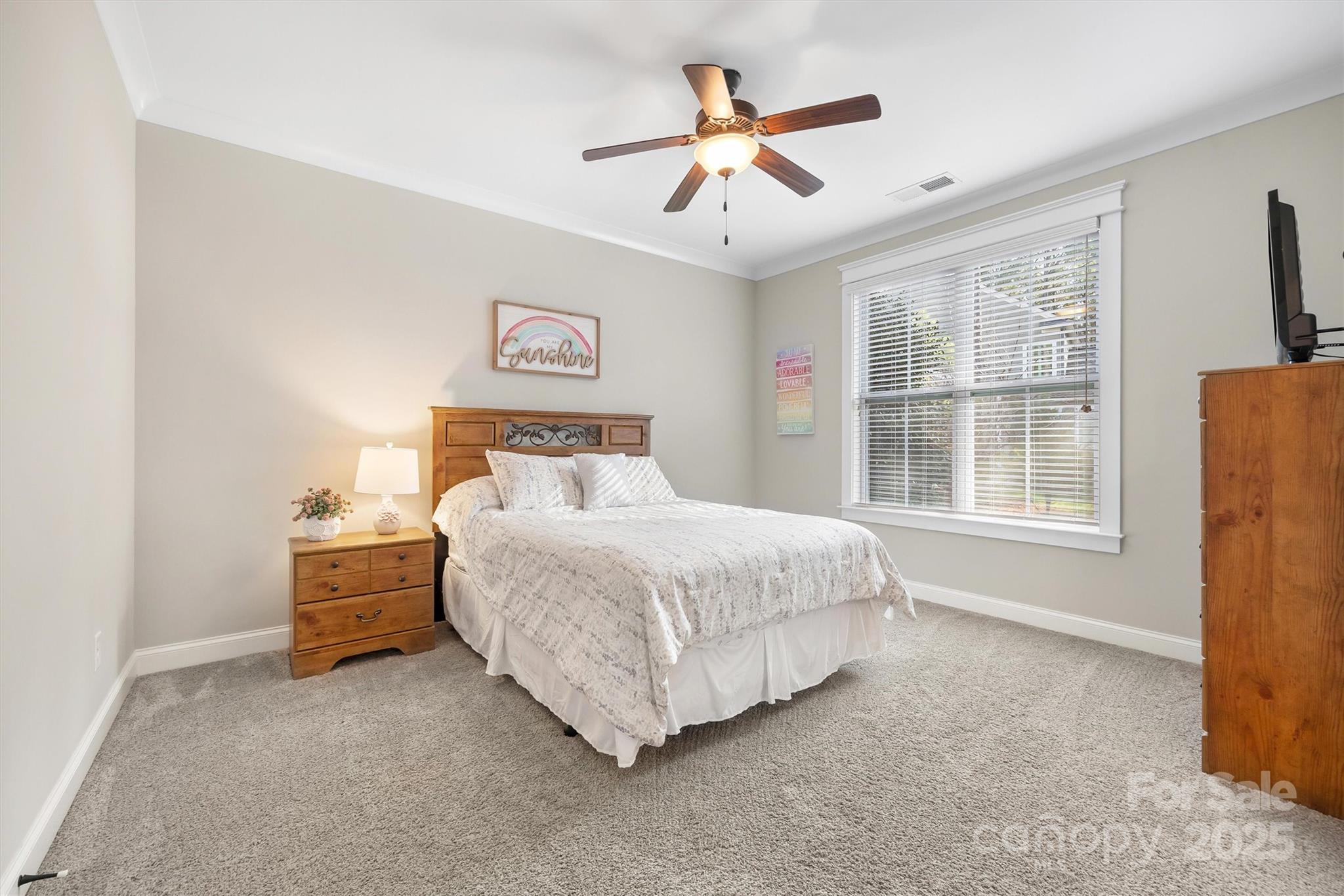 4221 Persimmon Road Lancaster, SC 29720 - Photo 16 of 48 a bedroom with a bed and a large window