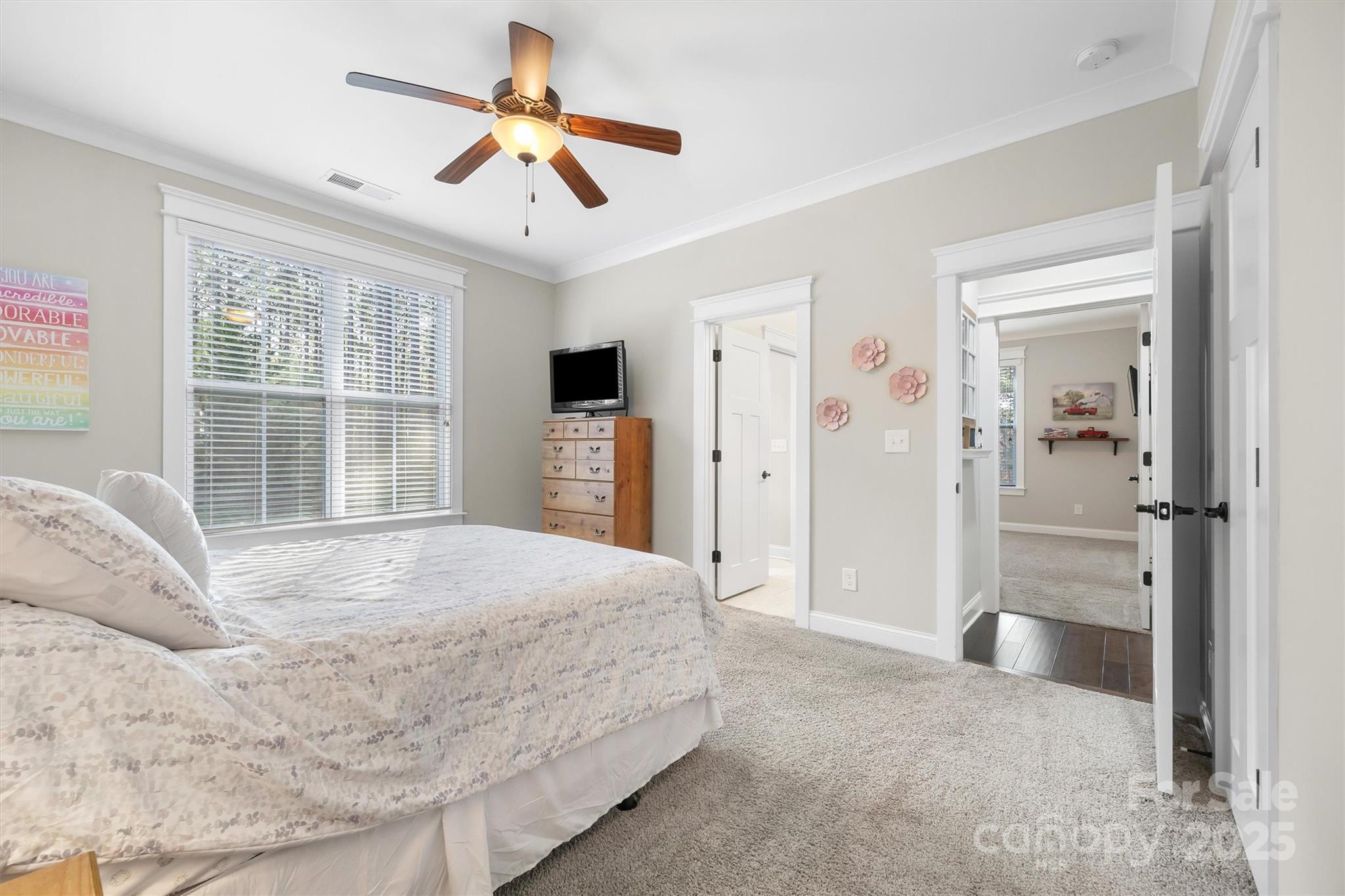 4221 Persimmon Road Lancaster, SC 29720 - Photo 17 of 48 a spacious bedroom with a large bed closet and window
