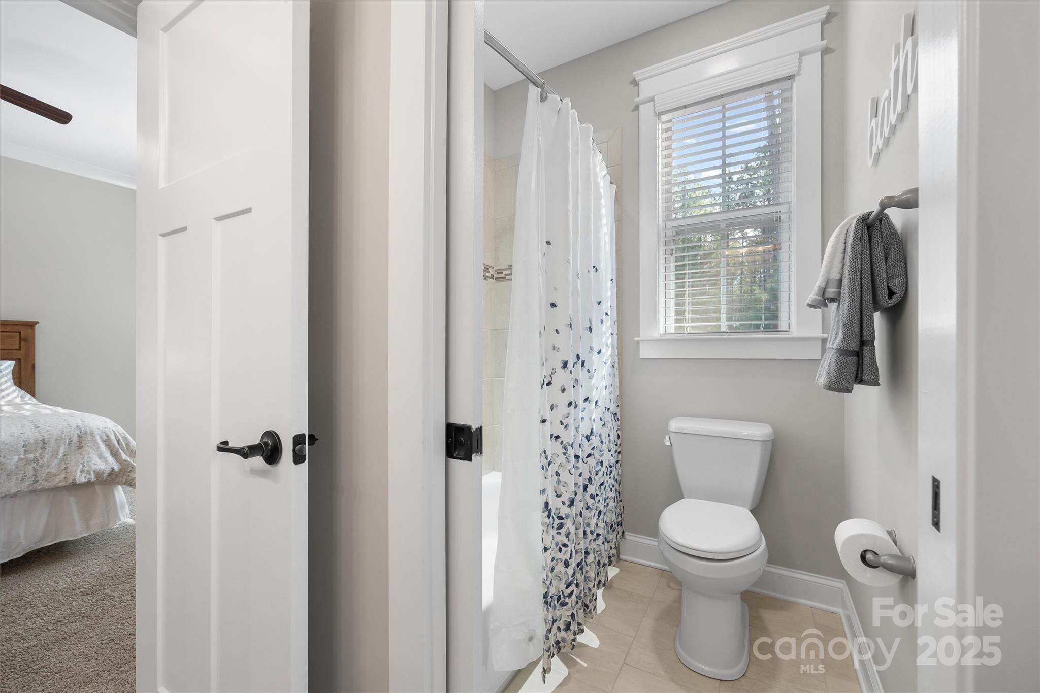 4221 Persimmon Road Lancaster, SC 29720 - Photo 19 of 48 a white toilet sitting next to a bathroom sink