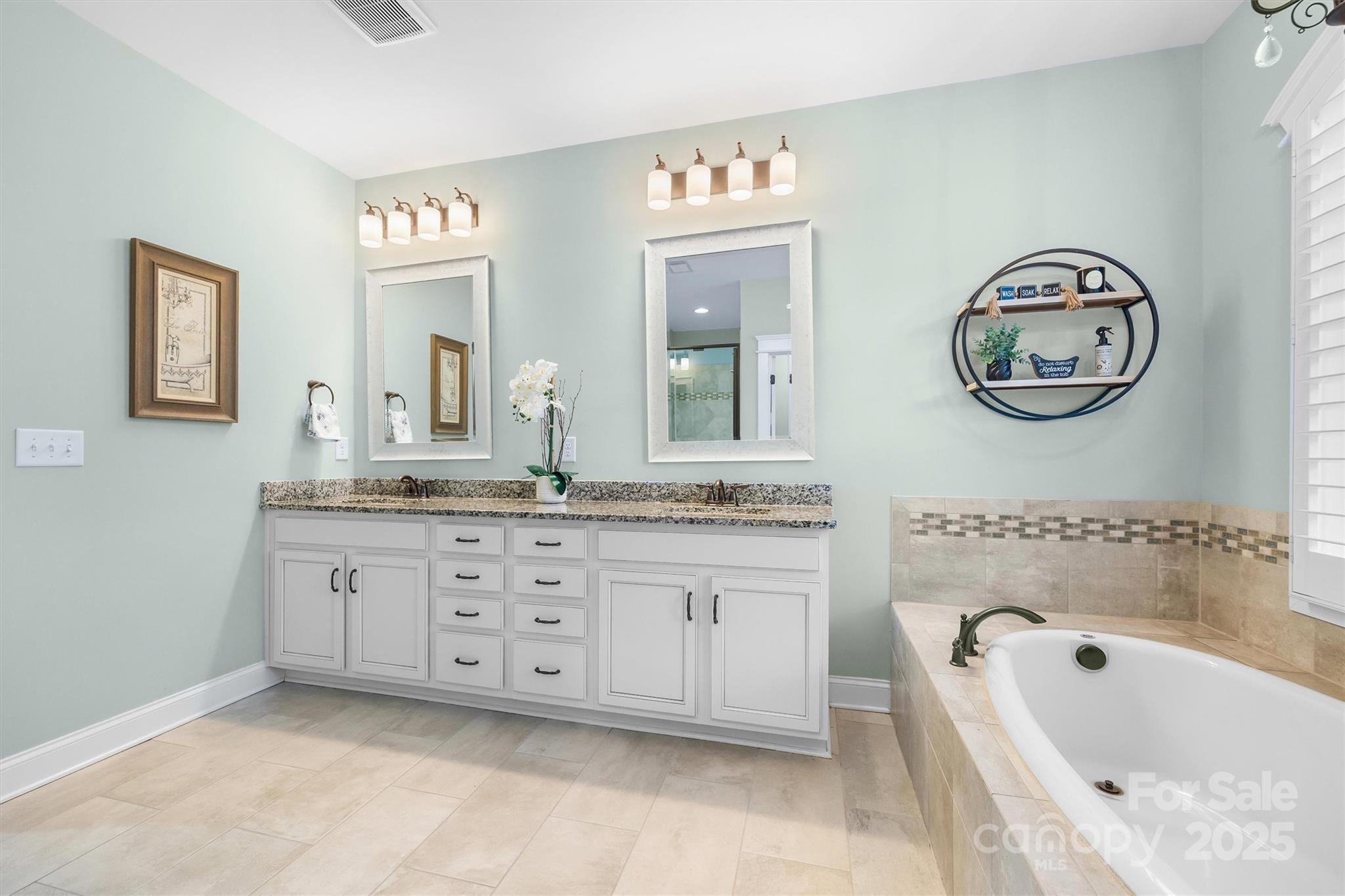 4221 Persimmon Road Lancaster, SC 29720 - Photo 26 of 48 a bathroom with a granite countertop sink mirror and bathtub