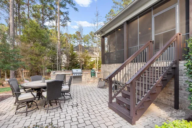 a view of a patio with a table and chairs