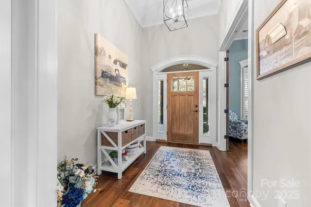 a room with furniture and a chandelier