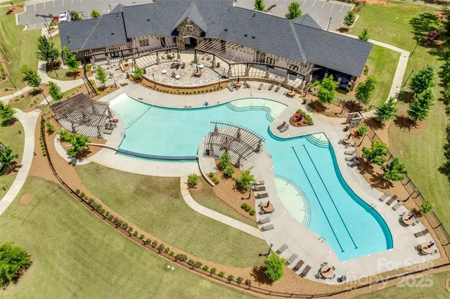 an aerial view of a house with outdoor space