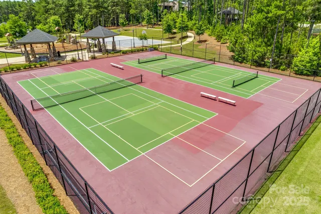 a view of a swimming pool with an outdoor seating and yard