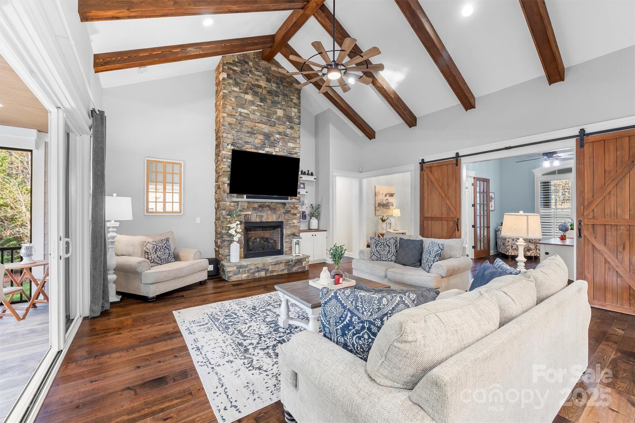 4221 Persimmon Road Lancaster, SC 29720 - Photo 8 of 48 a living room with furniture a fireplace and a flat screen tv