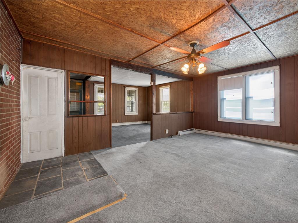 15845 Kutztown Road Mertztown, PA 19539 - Photo 7 of 24 A spacious room offers an entry with tile flooring, flowing into carpeted living areas.