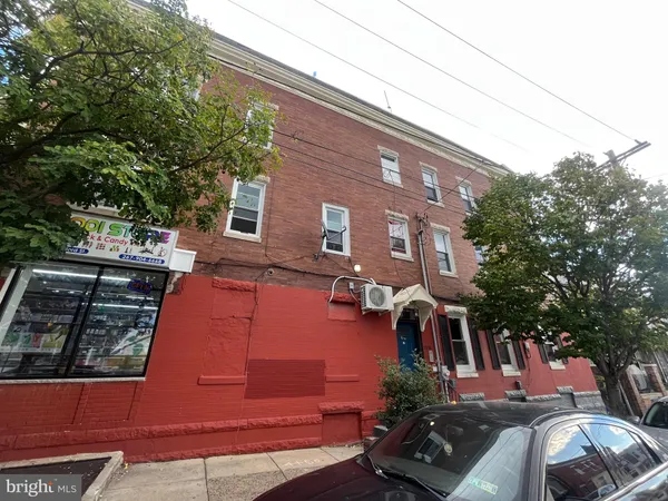 a view of a house with a tree