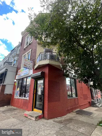 a view of brick building with large windows