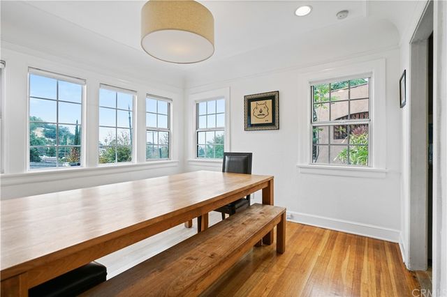 a view of a room with wooden floor and window