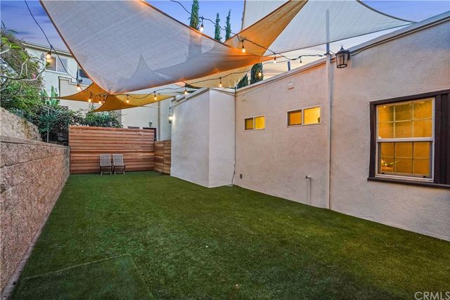 a view of a backyard with sitting area