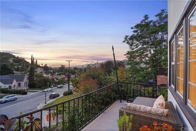 a view of a balcony with furniture