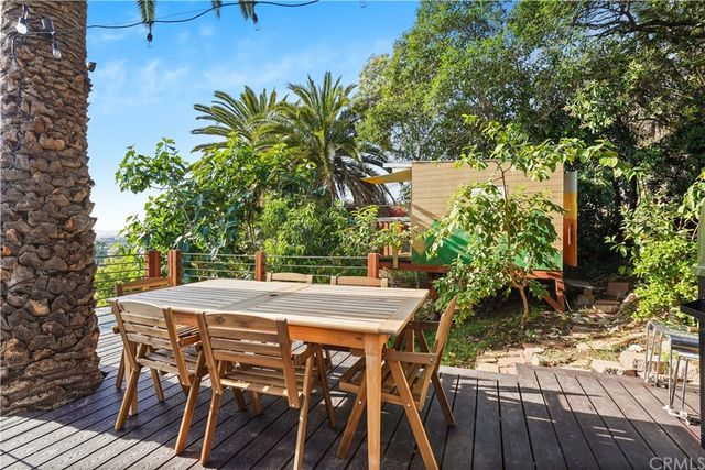 a view of an outdoor space with table and chairs