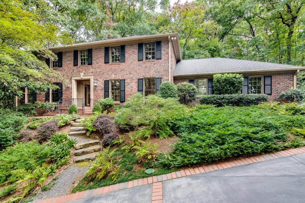 4473 Sentinel Post Road Northwest Atlanta, GA 30327 - Photo 1 of 1 a front view of a house with a yard