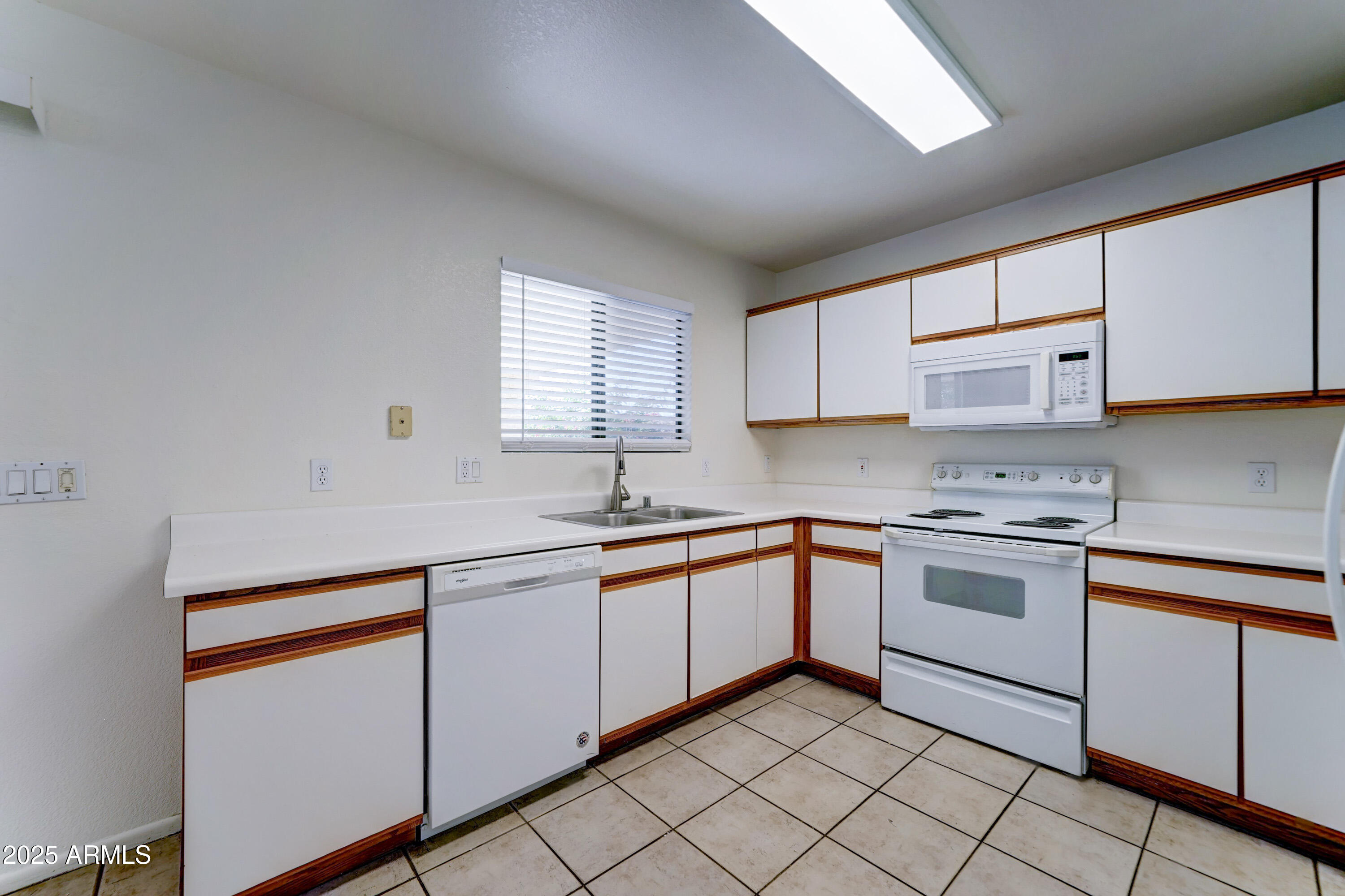 Undisclosed Address Phoenix, AZ 85024 - Photo 12 of 32 a kitchen with stainless steel appliances granite countertop a sink stove and cabinets