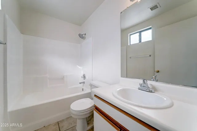 a bathroom with a sink toilet a mirror and shower