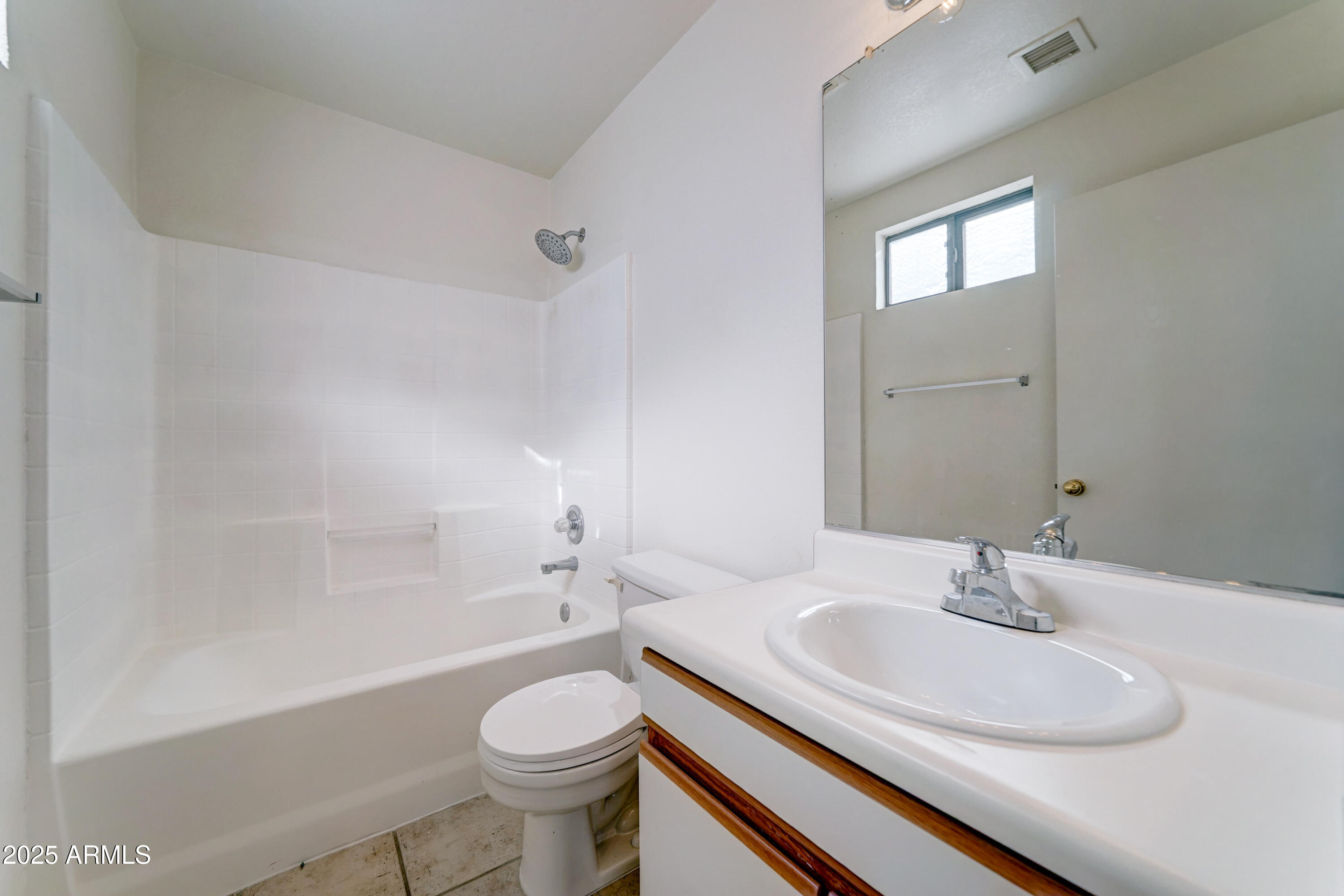 Undisclosed Address Phoenix, AZ 85024 - Photo 19 of 32 a bathroom with a sink toilet a mirror and shower