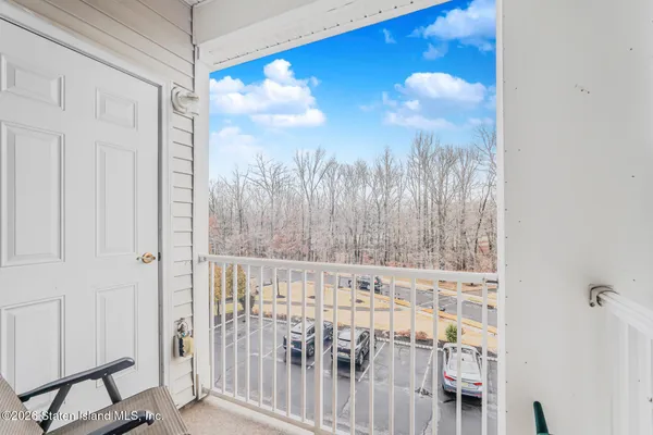 a view of a glass door with a balcony