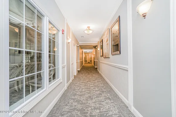 a view of a hallway with windows