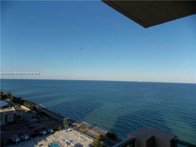 a view of an ocean from a balcony