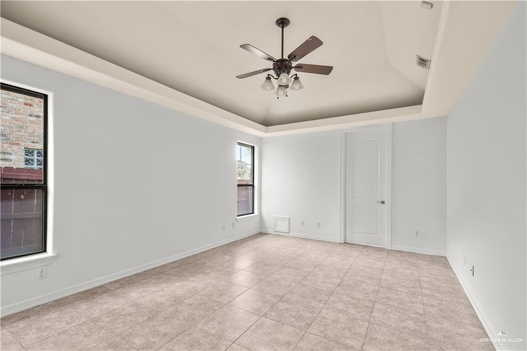 2913 San Rodrigo Mission, TX 78572 - Photo 13 of 29 a view of a livingroom with a ceiling fan and window