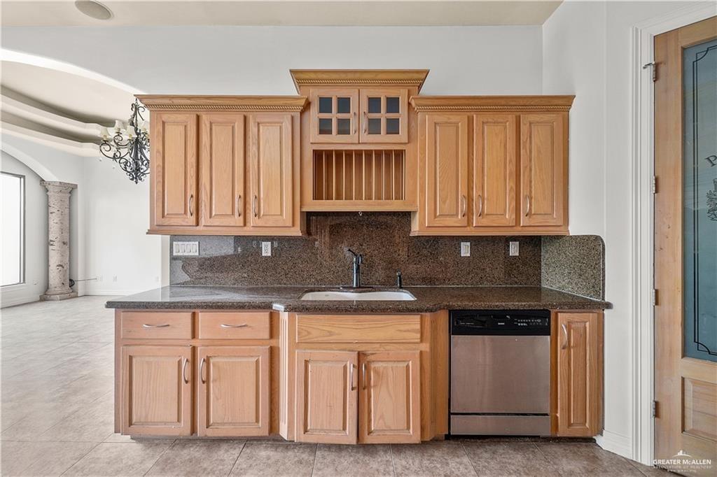 2913 San Rodrigo Mission, TX 78572 - Photo 10 of 29 a kitchen with white cabinets and a sink