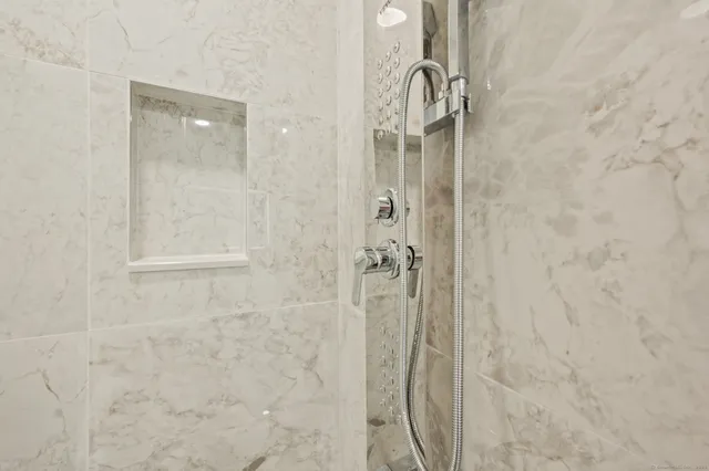 a bathroom with a glass shower door