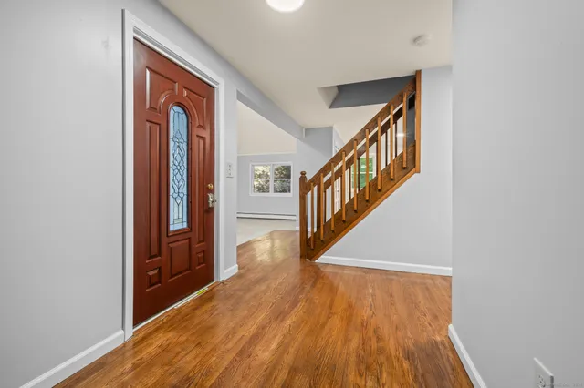 a view of entryway with wooden floor