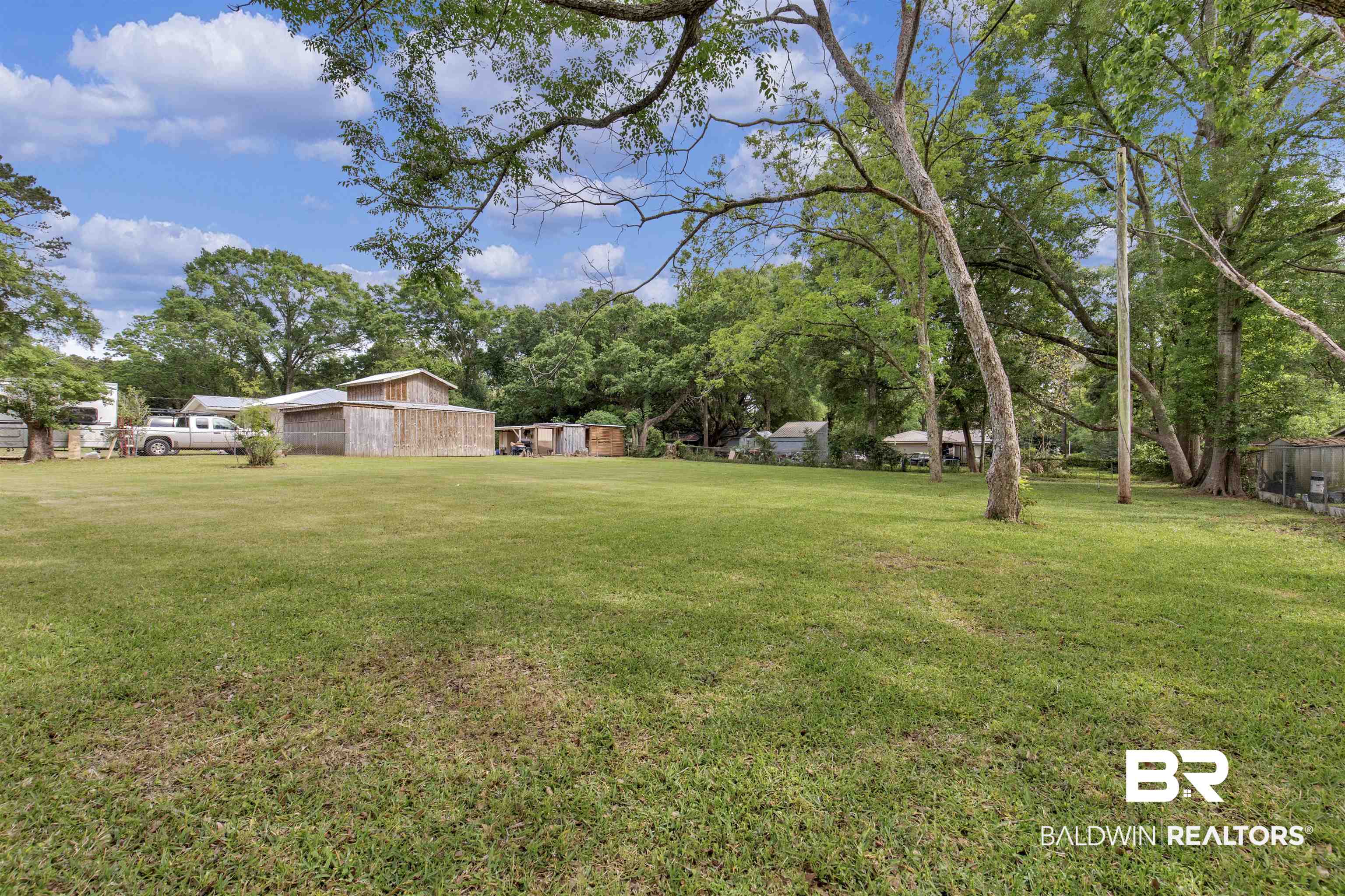 9241 Vallaris Street North Mobile, AL 36608 - Photo 15 of 17 View of yard with fence and an outbuilding