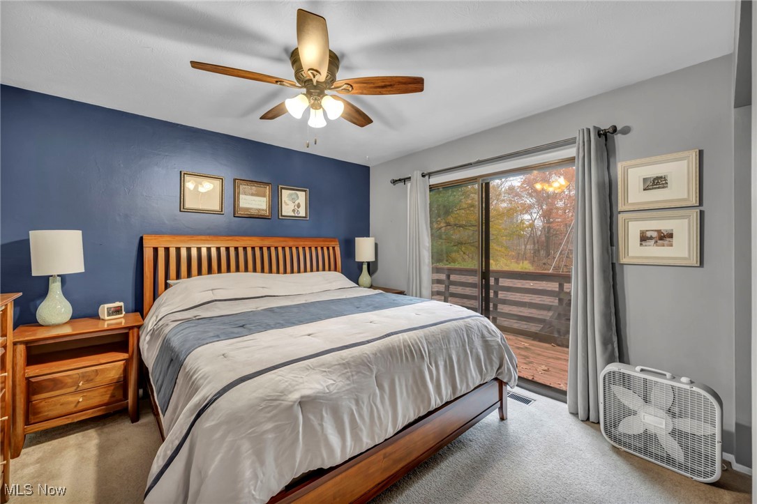 3739 Martha Road Kent, OH 44240 - Photo 23 of 50 Carpeted bedroom with access to exterior and ceiling fan