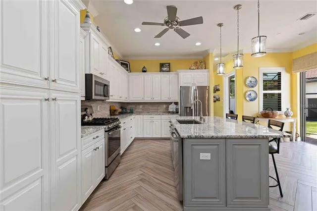 a view of a livingroom with furniture and a flat screen tv