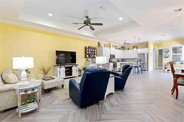 a spacious bathroom with a granite countertop sink a toilet a mirror and shower