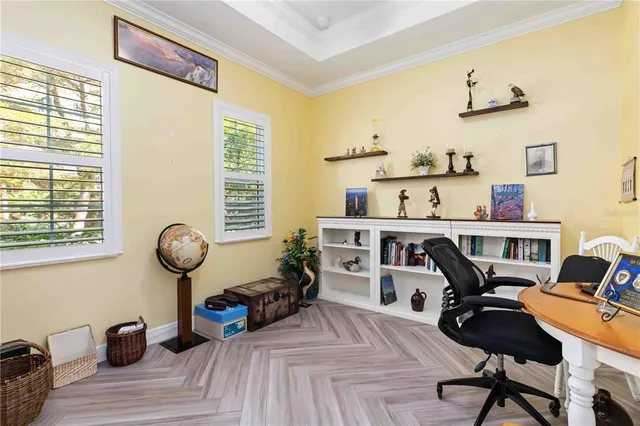 a bedroom with a bed and a large mirror