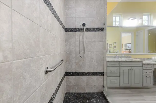 a view of a patio with table and chairs a barbeque with wooden fence