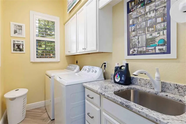 an aerial view of residential houses with green space