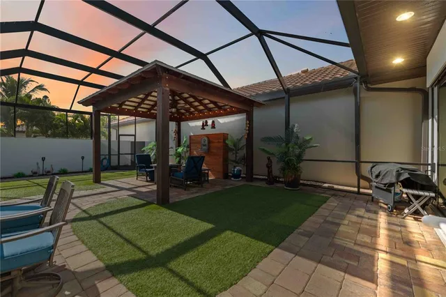 an aerial view of residential houses with green space