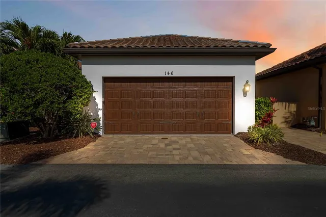 an aerial view of residential houses with city view