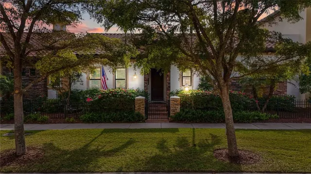 a front view of a house with garden