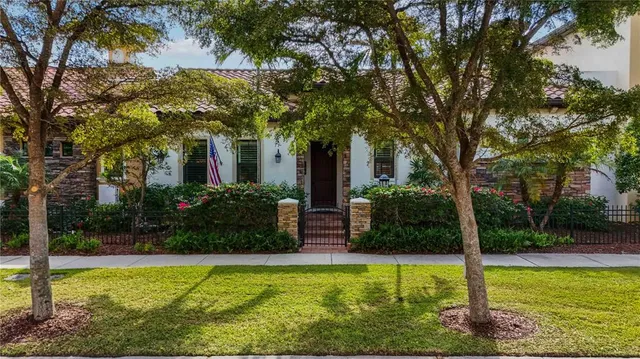 a front view of a house with plants